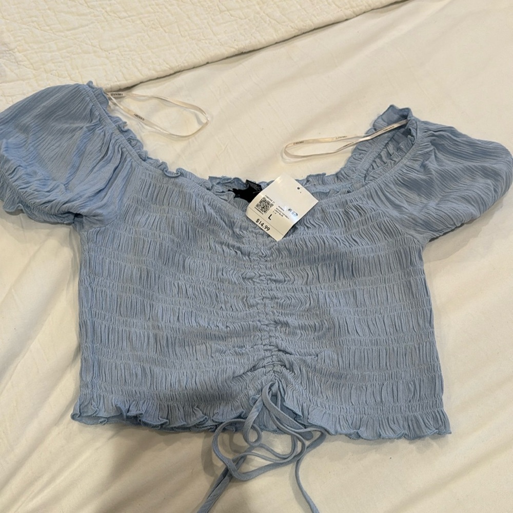 Light blue top forever 21. Size Large. New with tags.
